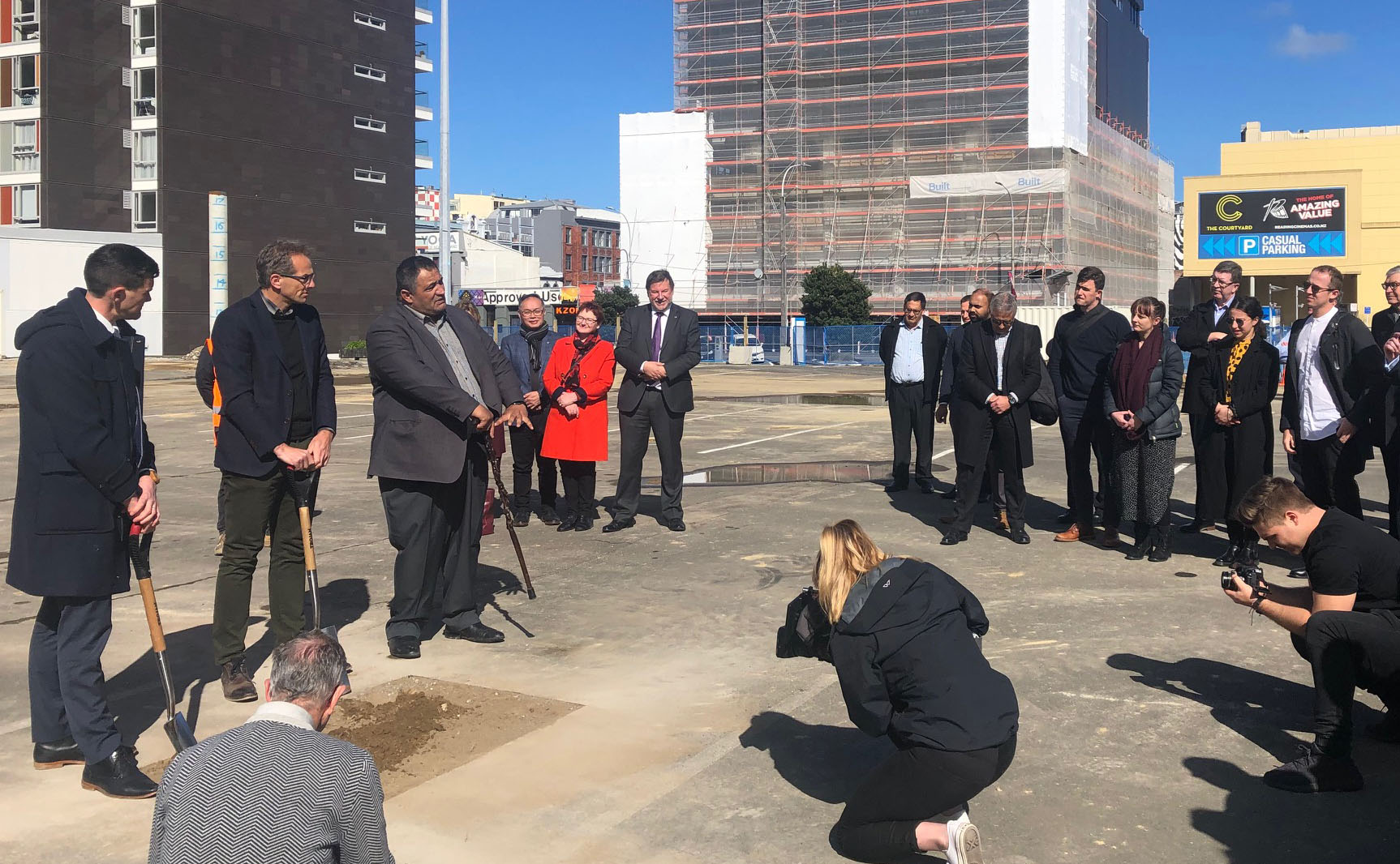 Mayor Justin Lester, David Perks (General Manager of WellingtonNZ) and Kura Moeahu of Te Āti Awa speak and break ground at the site of the new Wellington Convention and Exhibition Centre