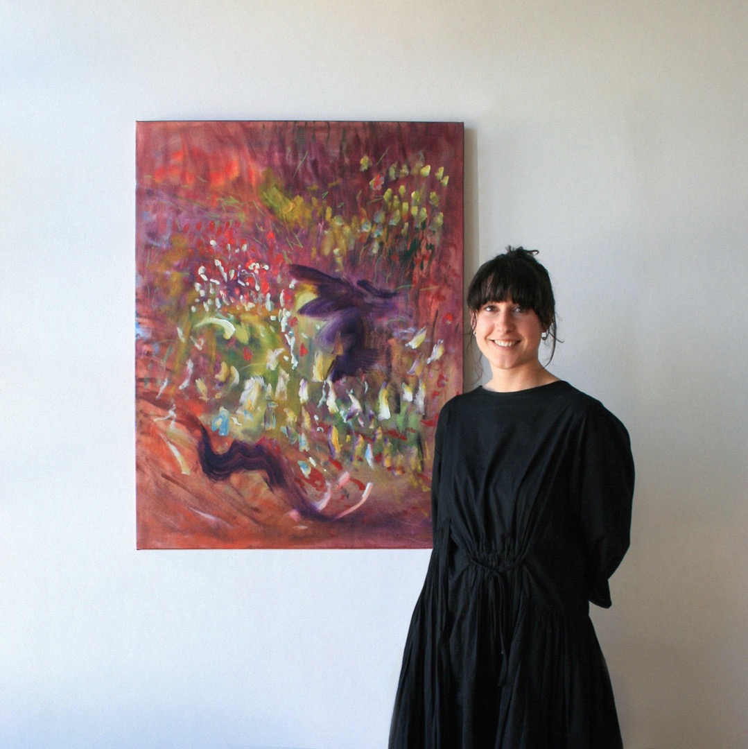 Hannah Walsh standing in front of her artwork 'Warm Wind' commissioned by Studio Pacific.