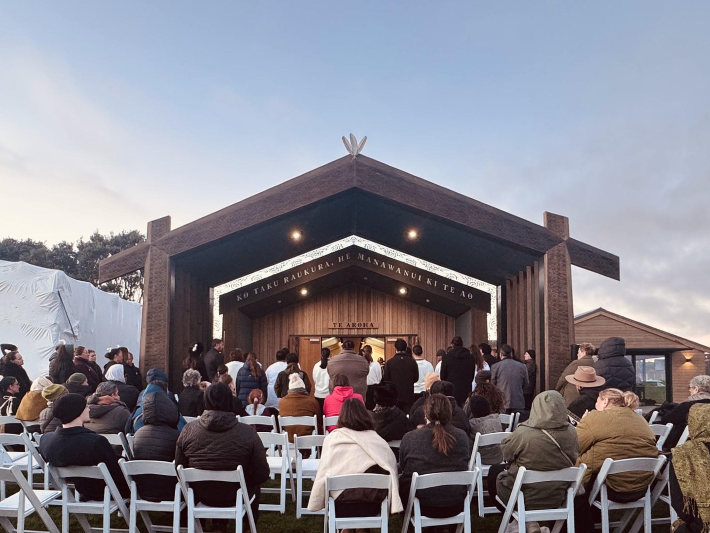 Whānau gather at dawn for the blessing and opening of Te Aroha at Urenui Pā.